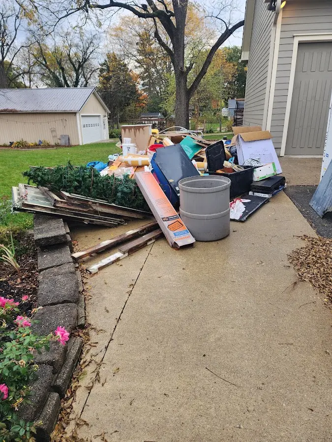 Dumpster being loaded with debris for 30 Yard Dumpster Rental in Eaton